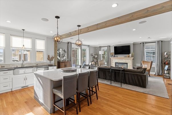 Fireplace, Interior, Kitchen, Living room, Pendant Lights, Recessed Lighting, Stainless Steel Appliances, Wooden Beams, Wood Texture Flooring