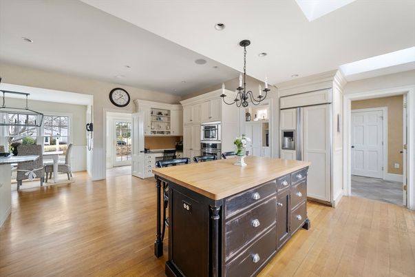 Chandelier, Dining room, Interior, Kitchen, Recessed Lighting, Stainless Steel Appliances, Wood Texture Flooring