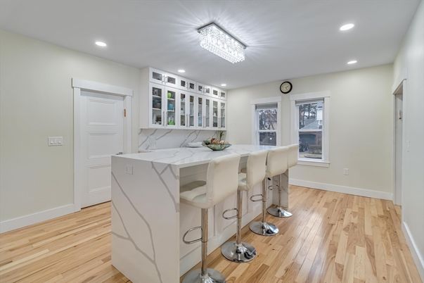 Dining room, Fireplace, Interior, Living room, Recessed Lighting, Wood Texture Flooring