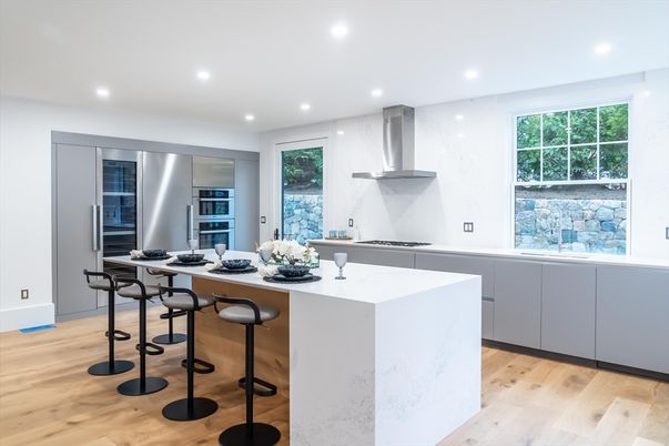 Interior, Kitchen, Marble Walls, Recessed Lighting, Stainless Steel Appliances, Wood Texture Flooring