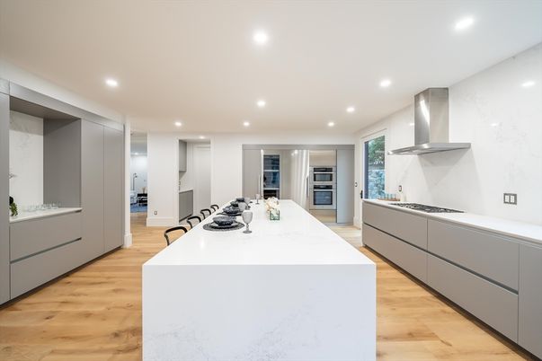 Interior, Kitchen, Marble Walls, Recessed Lighting, Stainless Steel Appliances, Wood Texture Flooring