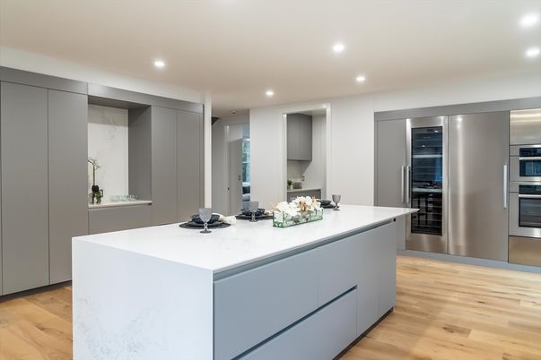 Interior, Kitchen, Marble Walls, Recessed Lighting, Stainless Steel Appliances, Wood Texture Flooring
