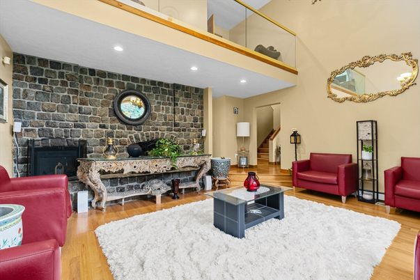 Fireplace, Interior, Living room, Piano, Recessed Lighting, Stone Walls, Wood Texture Flooring