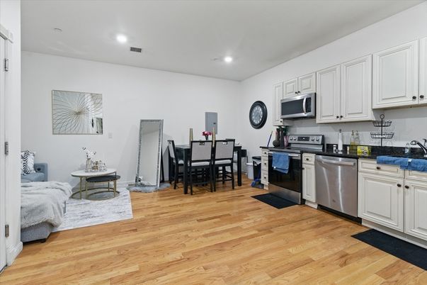 Dining room, Interior, Kitchen, Recessed Lighting, Stainless Steel Appliances, Wood Texture Flooring