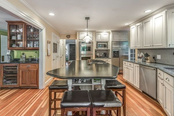 Dining room, Interior, Kitchen, Pendant Lights, Recessed Lighting, Stainless Steel Appliances, Wood Texture Flooring