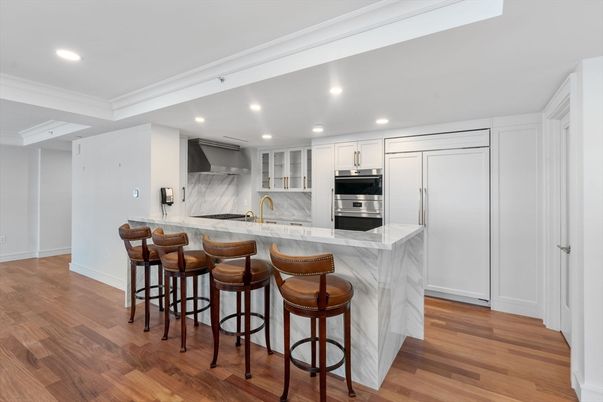 Interior, Kitchen, Marble Walls, Recessed Lighting, Stainless Steel Appliances, Wood Texture Flooring