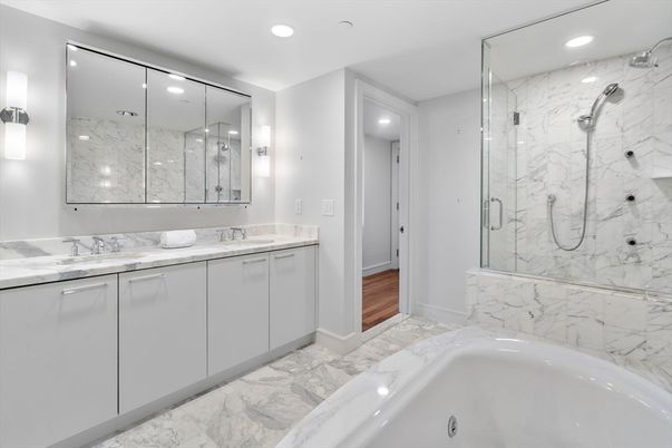 Bathroom, Dual Sink Vanities, Glass Shower, Interior, Marble, Marble Walls, Recessed Lighting