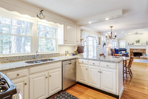 Chandelier, Fireplace, Interior, Kitchen, Recessed Lighting, Stainless Steel Appliances, Wood Texture Flooring