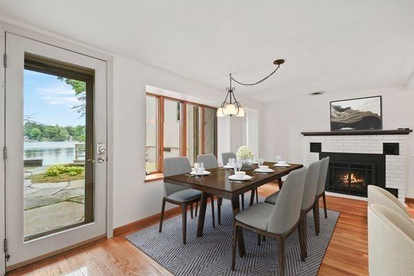 Dining room, Fireplace, Interior, Pendant Lights, Water, Wood Texture Flooring