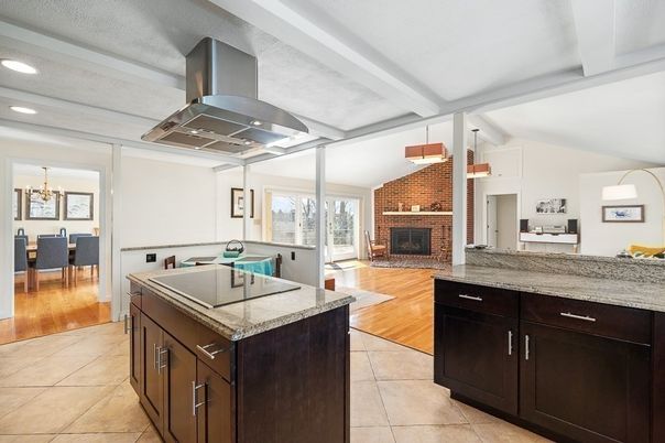 Chandelier, Dining room, Fireplace, Interior, Kitchen, Living room, Recessed Lighting, Stone Walls, Wood Texture Flooring