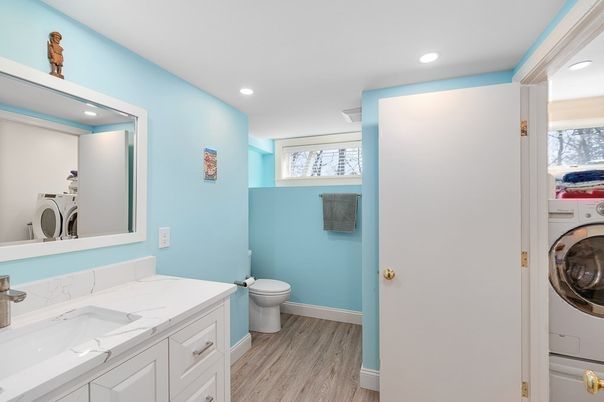 Bathroom, Interior, Recessed Lighting, Utility Closets, Washer, Wood Texture Flooring