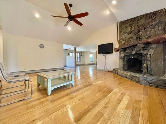 Empty room, Fireplace, Interior, Recessed Lighting, Stone Walls, Wood Texture Flooring