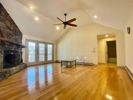 Empty room, Fireplace, Interior, Recessed Lighting, Stone Walls, Wood Texture Flooring