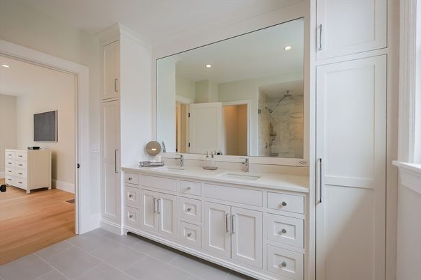 Bathroom, Dual Sink Vanities, Interior, Marble Walls, Recessed Lighting, Wood Texture Flooring