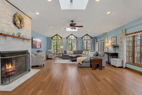 Fireplace, Interior, Living room, Recessed Lighting, Stone Walls, Wood Texture Flooring