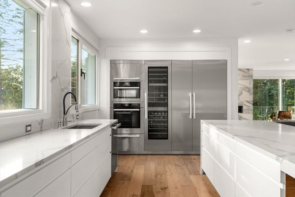 Interior, Kitchen, Marble Walls, Recessed Lighting, Stainless Steel Appliances, Wood Texture Flooring