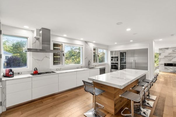 Interior, Kitchen, Marble Walls, Recessed Lighting, Stainless Steel Appliances, Wood Texture Flooring