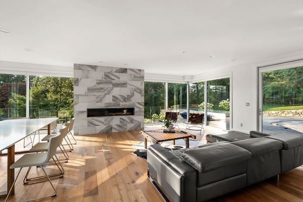 Dining room, Fireplace, Interior, Living room, Marble Walls, Recessed Lighting, Wood Texture Flooring