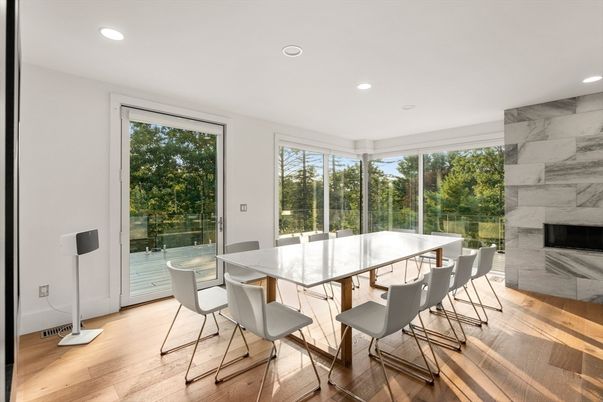 Dining room, Fireplace, Interior, Marble Walls, Recessed Lighting, Wood Texture Flooring