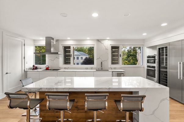 Interior, Kitchen, Marble Walls, Recessed Lighting, Stainless Steel Appliances, Wood Texture Flooring