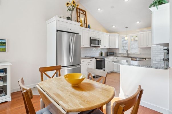 Dining room, Interior, Kitchen, Pendant Lights, Recessed Lighting, Stainless Steel Appliances, Wood Texture Flooring
