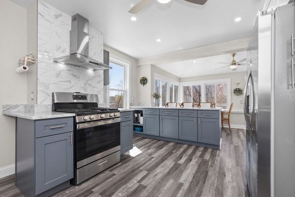 Interior, Kitchen, Marble Walls, Recessed Lighting, Stainless Steel Appliances, Wood Texture Flooring