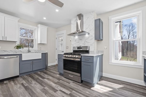 Interior, Kitchen, Marble Walls, Recessed Lighting, Stainless Steel Appliances, Wood Texture Flooring