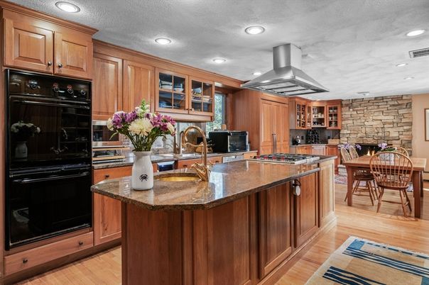 Dining room, Interior, Kitchen, Recessed Lighting, Stainless Steel Appliances, Stone Walls, Wood Texture Flooring
