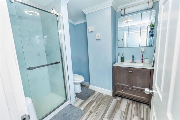 Bathroom, Glass Shower, Interior, Marble Walls, Wood Texture Flooring