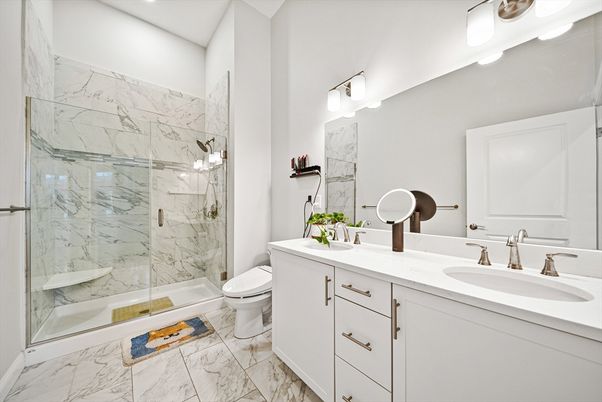 Bathroom, Dual Sink Vanities, Glass Shower, Interior, Marble, Marble Walls, Recessed Lighting
