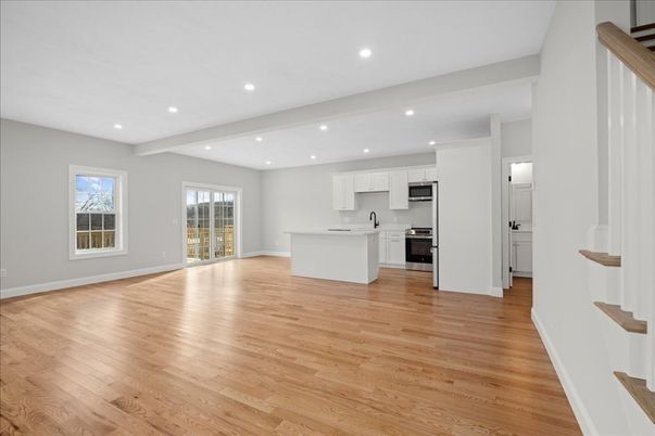 Empty room, Interior, Kitchen, Recessed Lighting, Stainless Steel Appliances, Wood Texture Flooring