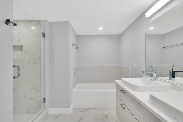 Bathroom, Dual Sink Vanities, Glass Shower, Interior, Marble, Marble Walls, Recessed Lighting