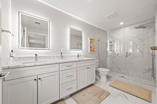 Bathroom, Dual Sink Vanities, Glass Shower, Interior, Marble, Marble Walls, Recessed Lighting