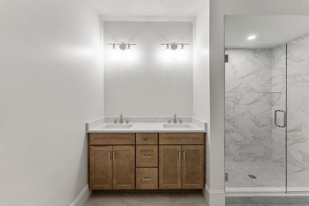 Bathroom, Dual Sink Vanities, Glass Shower, Interior, Marble Walls, Recessed Lighting