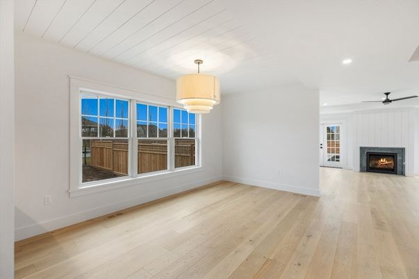 Chandelier, Empty room, Fireplace, Interior, Recessed Lighting, Wood Texture Flooring