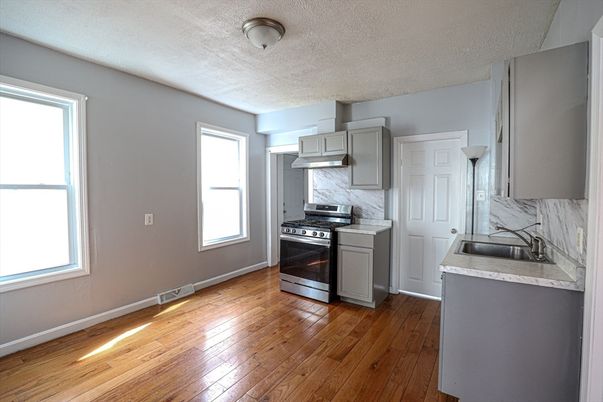 Interior, Kitchen, Marble Walls, Stainless Steel Appliances, Wood Texture Flooring