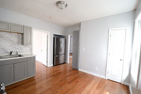 Interior, Kitchen, Marble Walls, Stainless Steel Appliances, Wood Texture Flooring