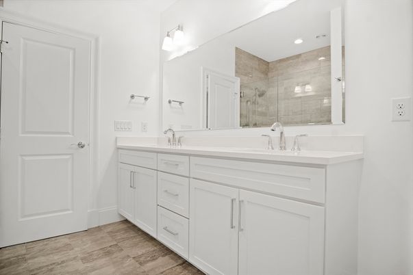 Bathroom, Dual Sink Vanities, Glass Shower, Interior, Recessed Lighting, Wood Texture Flooring