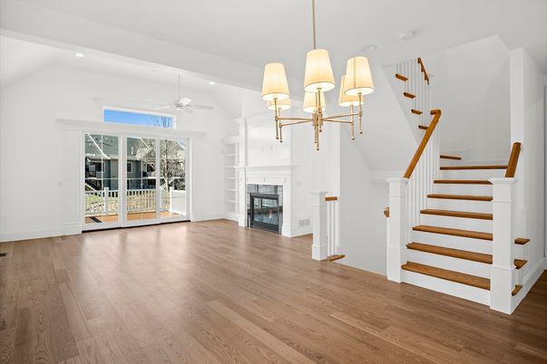 Chandelier, Empty room, Fireplace, Interior, Recessed Lighting, Wood Texture Flooring