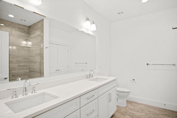 Bathroom, Dual Sink Vanities, Glass Shower, Interior, Recessed Lighting, Wood Texture Flooring