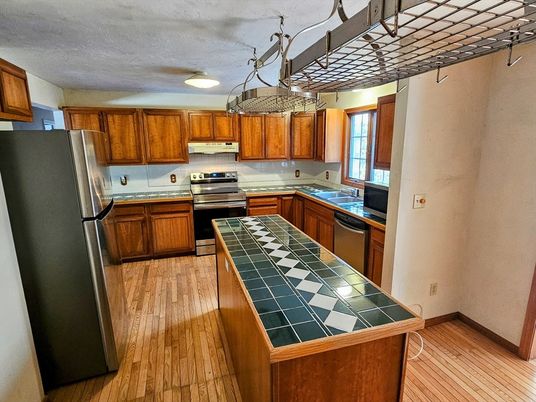 Interior, Kitchen, Stainless Steel Appliances, Tile Countertops, Wood Texture Flooring
