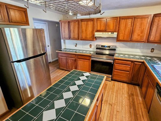Interior, Kitchen, Stainless Steel Appliances, Tile Countertops, Wood Texture Flooring