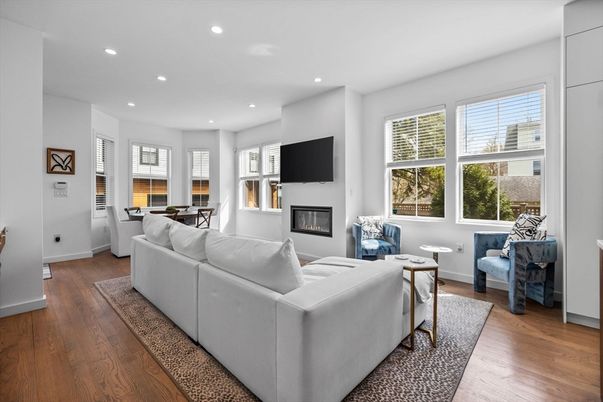 Dining room, Fireplace, Interior, Living room, Recessed Lighting, Wood Texture Flooring