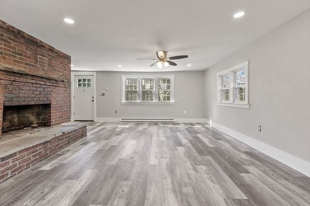 Empty room, Fireplace, Interior, Recessed Lighting, Stone Walls, Wood Texture Flooring