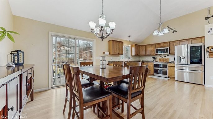 Chandelier, Dining room, Interior, Kitchen, Pendant Lights, Stainless Steel Appliances, Wood Texture Flooring