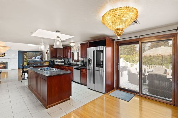Chandelier, Fireplace, Interior, Kitchen, Stainless Steel Appliances, Wood Texture Flooring