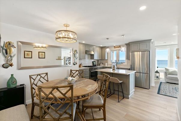 Dining room, Interior, Kitchen, Pendant Lights, Recessed Lighting, Stainless Steel Appliances, Water, Wood Texture Flooring