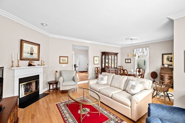 Chandelier, Dining room, Fireplace, Interior, Living room, Pendant Lights, Recessed Lighting, Wood Texture Flooring