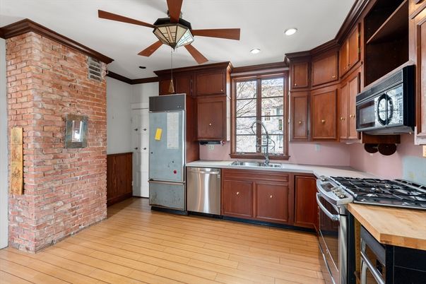 Interior, Kitchen, Recessed Lighting, Stainless Steel Appliances, Stone Walls, Wood Texture Flooring