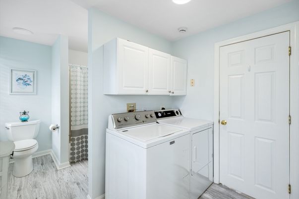 Bathroom, Interior, Recessed Lighting, Washer, Wood Texture Flooring